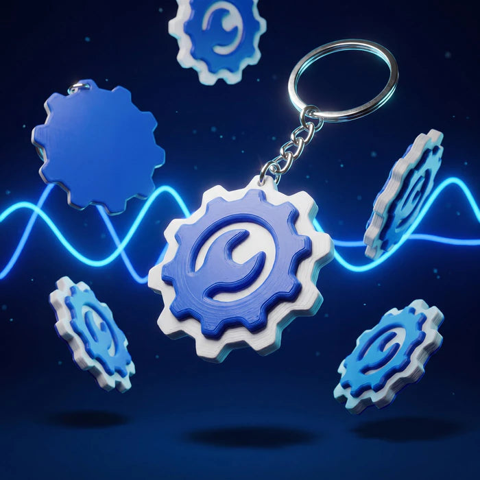 Niebiesko-białe breloki firmowe w kształcie trybików